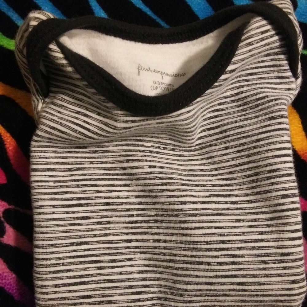 First Impressions baby onesie
